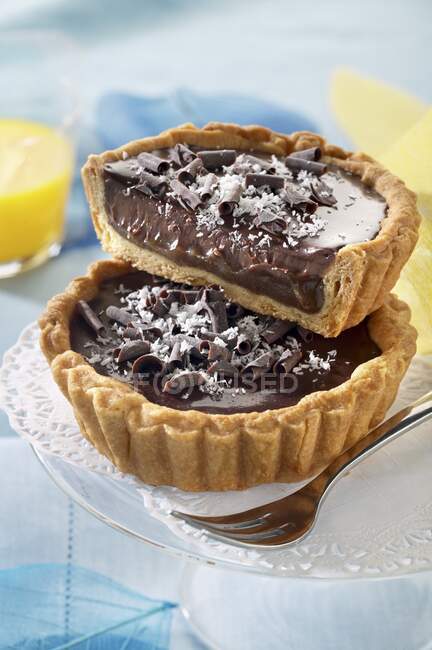 Exotic tartlets with dark chocolate cream and pineapple — Stock Photo