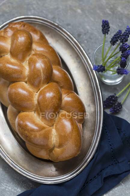 A yeast plait on a metal tray — Stock Photo