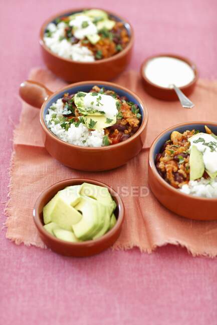 Chili con carne with rice and avocado — Stock Photo