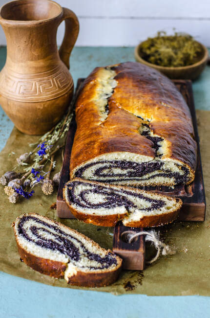 Poppy roll in a rustic style — Stock Photo