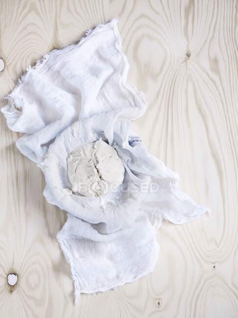 Homemade ricotta in a gauze cloth — Stock Photo