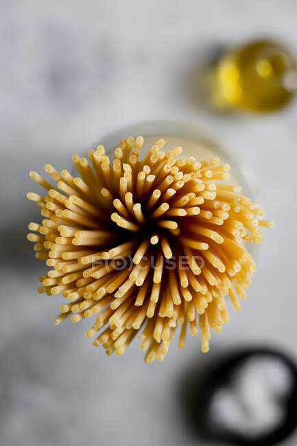 Close up of bucatini pasta on a light surface — Stock Photo