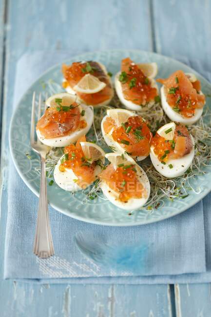 Eggs with smoked salmon, caviar and shoots — Stock Photo