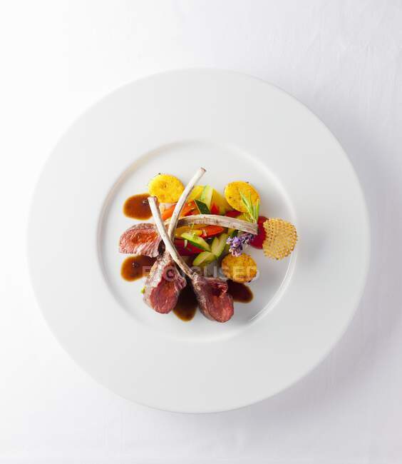 Lamb loin with courgettes and polenta — Stock Photo