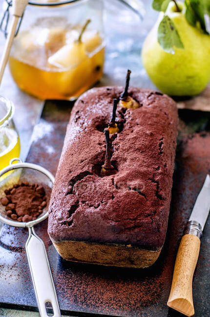 Close-up shot of delicious Chocolate cake with whole pears — Stock Photo