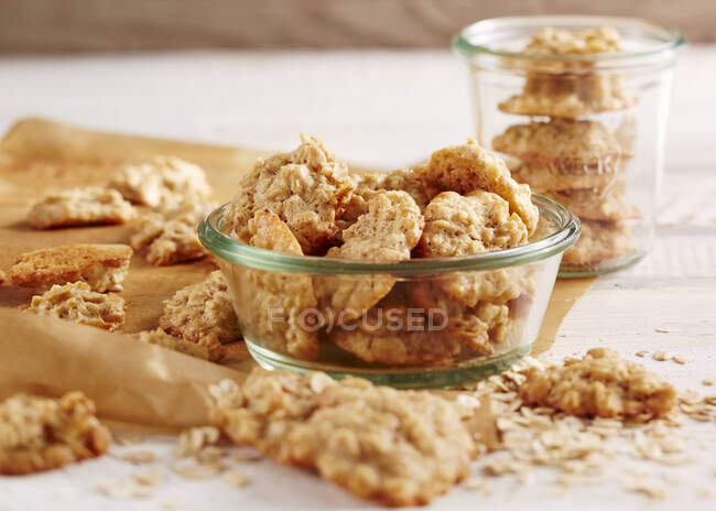Oat biscuits on table and in board and jar — Stock Photo