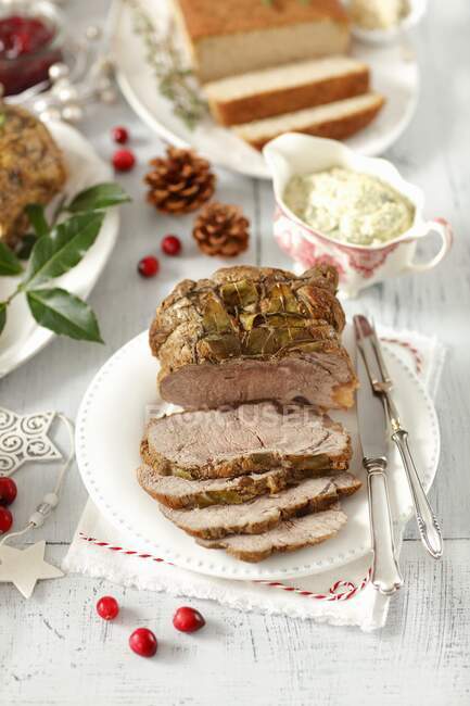 Beef roast with bay leaves and a herb and caper mayonnaise — Stock Photo