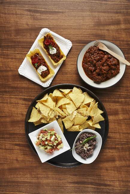 Tacos with guacamole, chilli con carne and bean paste — Stock Photo
