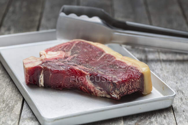 Raw dry aged T-bone steak — Stock Photo