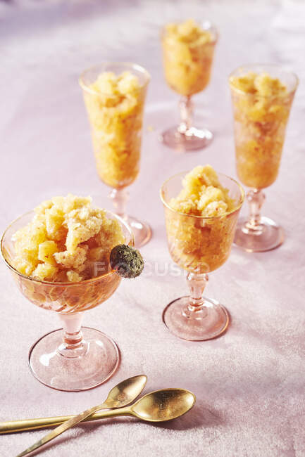 Granita in dessert glasses with vintage spoons — Stock Photo