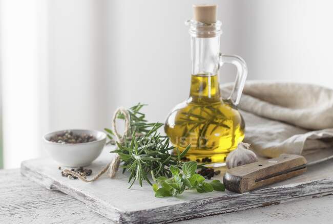 Italian herbs with olive oil and pepper — Stock Photo
