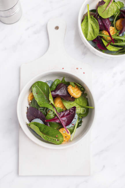 Gnocchi Salad in a white bowl on a marble table — Stock Photo