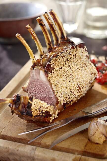Lamb loin back joint with a sesame seed crust — Stock Photo