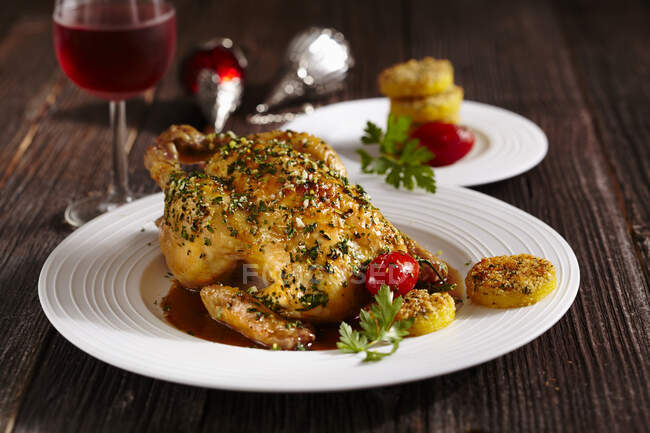 Roasted spring chicken with lemon and polenta fritters — Stock Photo