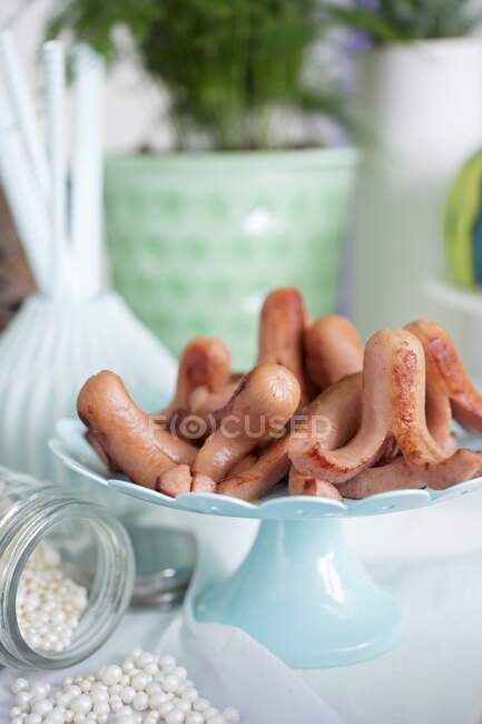 Small octopus sausages for a maritime themed party — Stock Photo