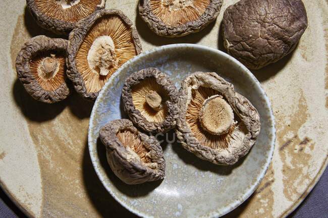 Fresh shiitake champignon mushrooms on the wooden table — Stock Photo
