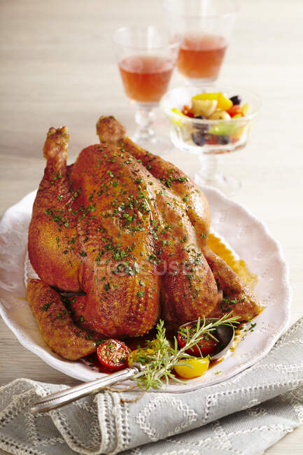 Roasted capon with a pepper and tomato medley — Stock Photo