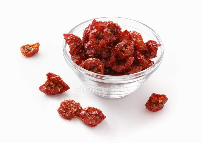 Dried cherry tomatoes in a glass bowl — Stock Photo