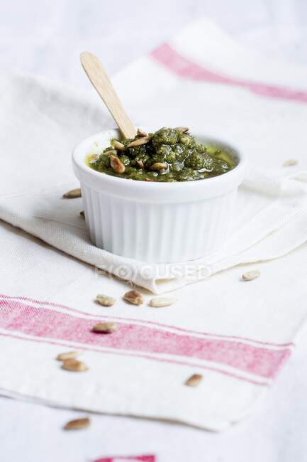 Green pesto with pine nuts — Stock Photo