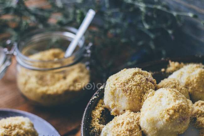 Plum dumplings with breadcrumbs — Stock Photo
