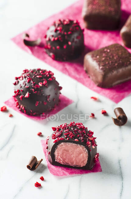 Raspberry and chocolate pralines — Stock Photo