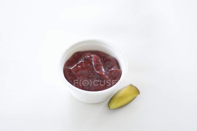 Ketchup and pickled gherkin — Stock Photo