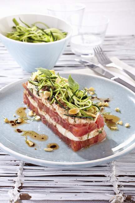 Red and white vegetable terrine with mozzarella, courgette pasta and basil — Stock Photo