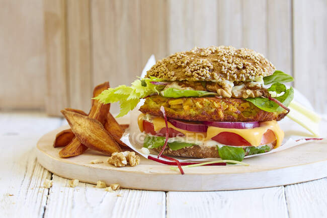 A vegetable burger with walnuts and celery — Stock Photo