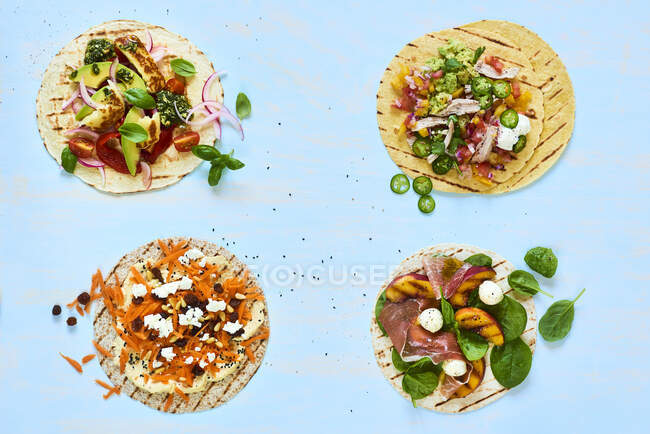 Tortillas with different toppings — Stock Photo