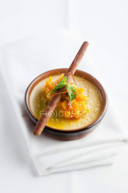 Creme brulee with a cinnamon stick — Stock Photo