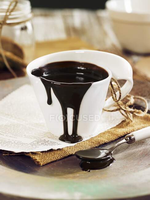 Chocolate sauce in a cup — Stock Photo