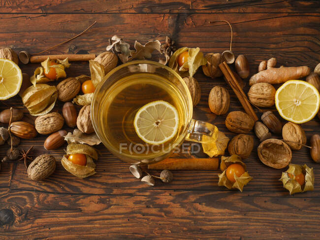Christmas teas with decoration on a wooden surface — Stock Photo