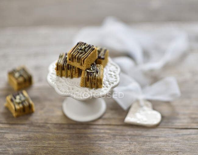 Vegan pumpkin and tiger nut sweets with pumpkin nougat and dark chocolate — Stock Photo