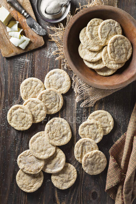 Sugar cookies on table and in bowl with butter — Stock Photo