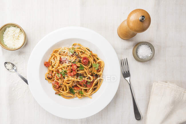 Amatriciana pasta in white bowl — Stock Photo