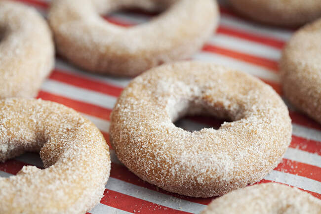 Donuts with sugar and sprinkles — Stock Photo