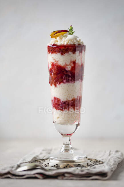 Close-up shot of delicious Rice pudding with plum sauce — Stock Photo