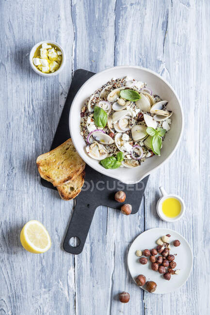Quinoa salad with clams and hazelnuts — Stock Photo