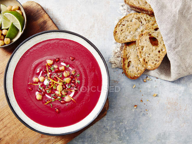 Beetroot soup served with sourdough bread — Stock Photo