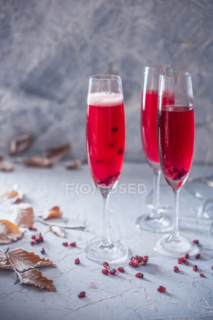 Three pomegranate champagne cocktails — Stock Photo