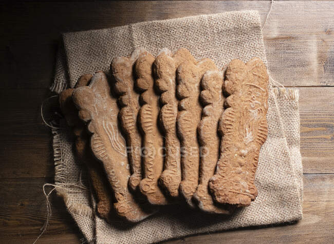 Santa shaped cookies on sack cloth — Stock Photo