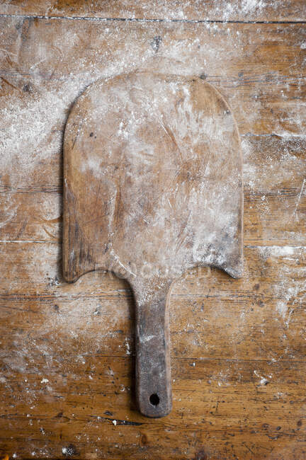 An old wooden bread paddle — Stock Photo