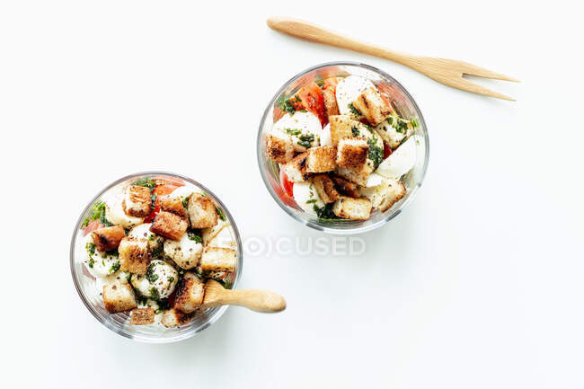 Caprese salad with croutons in glasses — Stock Photo