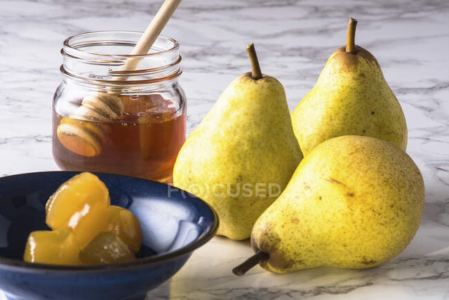 Homemade pear jam with honey and a jar of pears — Stock Photo