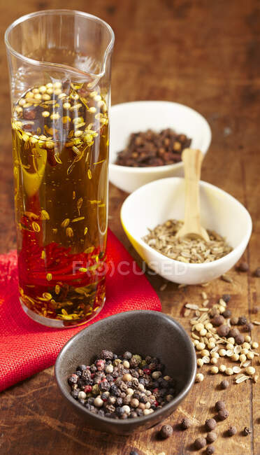 Homemade savory spice oil in a glass carafe — Stock Photo