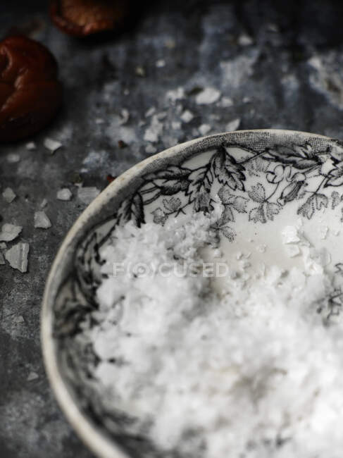 Salt flakes in a bowl — Stock Photo