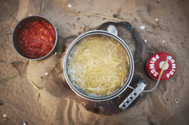 Noodles being cooked on a gas burner — Stock Photo