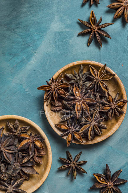 Close-up shot of delicious Star Anise on blue surface — Stock Photo
