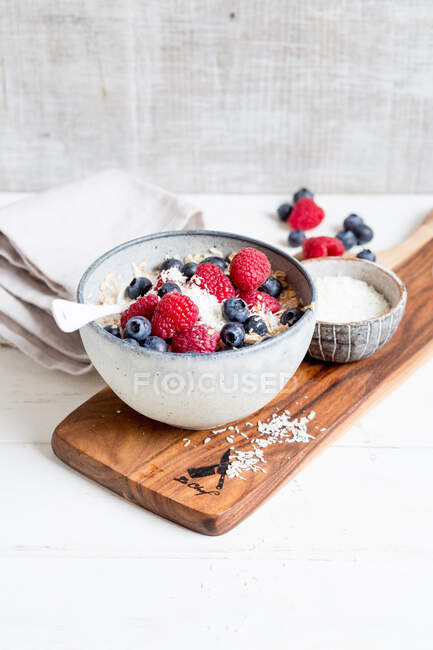 Muesli with berries and grated coconut — Stock Photo