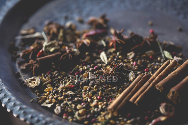 Spices and herbs on a wooden background — Stock Photo